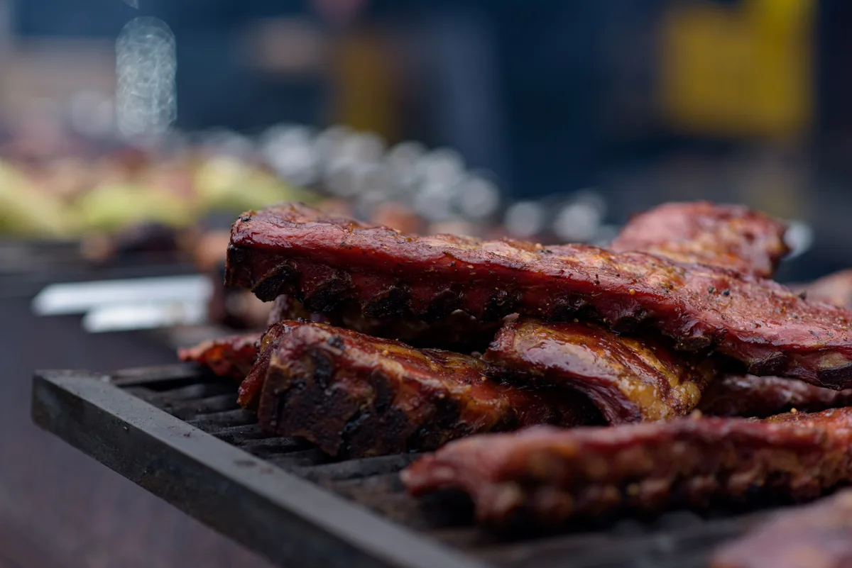 Grilled Pork Baby Ribs With Barbecue Sauce On The Grill. Festival Street Food